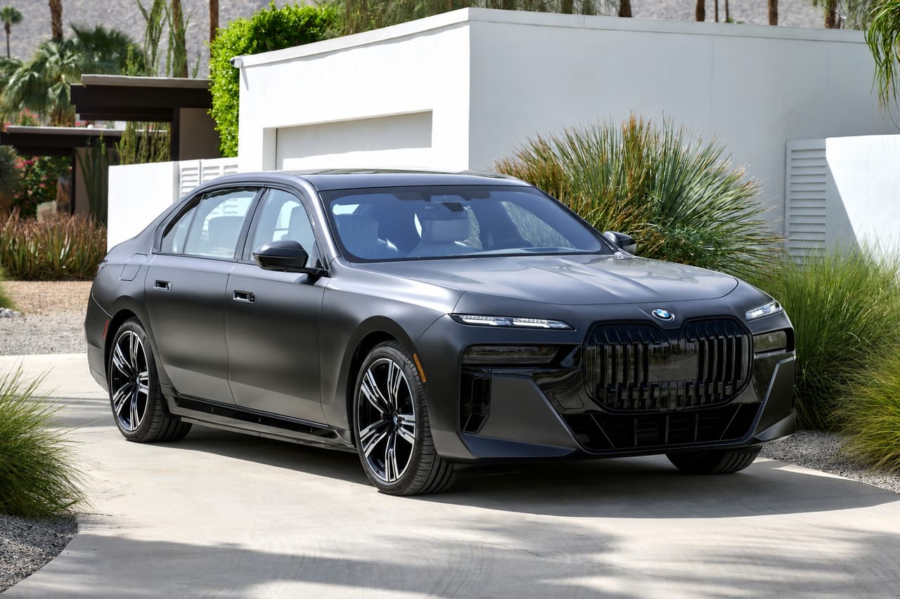 A matte gray BMW 7 Series on its factory wheels