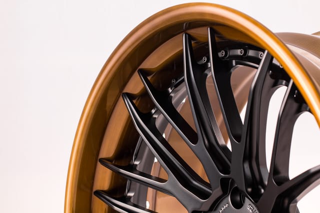 Matte Black Brushed Copper Lip finish on the Savini BM13L forged wheel